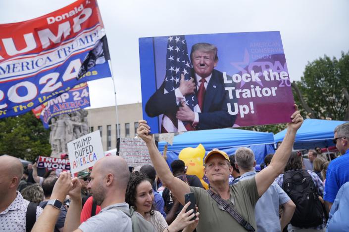 Protestors gather outside of the E. Barrett Prettyman United States Courthouse before Former President Donald Trump arrives to be arraigned on four charges related to the 2020 election. Federal prosecutors are accusing the Trump of undermining American democracy by organizing a wide-ranging conspiracy to steal the 2020 election that prosecutors allege fueled a brazen and historic insurrection at the U.S. Capitol.