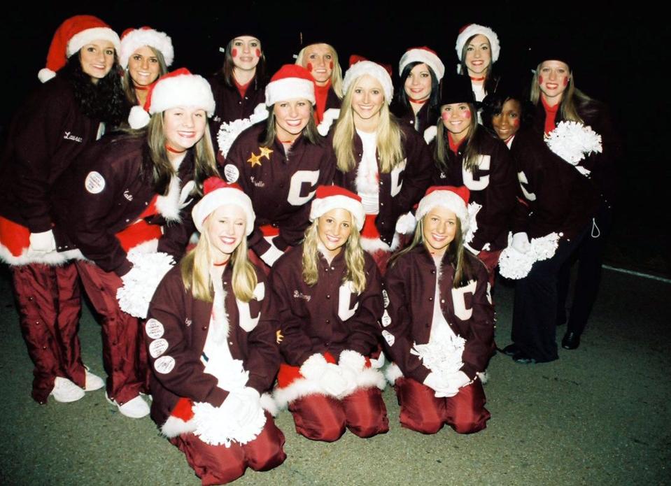 The Collierville High School varsity pom squad braved cold temperatures and gathered together for a team photo during the annual Collierville Christmas Parade.