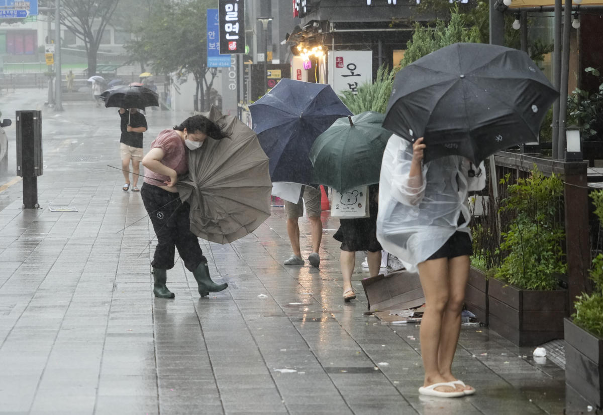 Khanun blows strong winds and heavy rains into South Korea, where thousands evacuated the coast